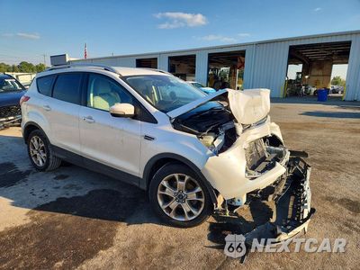 Czwarte zdjęcie samochodu z boku: 2016 FORD ESCAPE TITANIUM VIN:1FMCU0JX0GUC85794 - miniatura