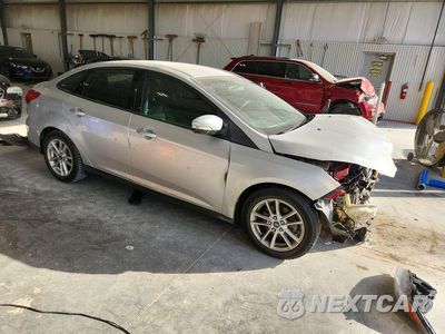 Czwarte zdjęcie samochodu z boku: 2017 FORD FOCUS SE VIN:1FADP3F25HL317294 - miniatura