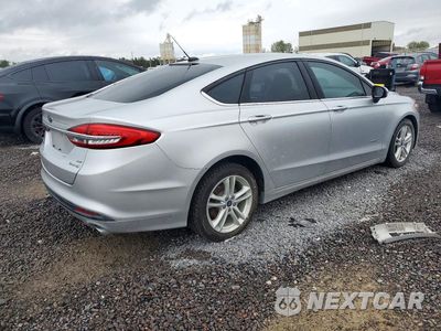 Trzecie zdjęcie samochodu z tyłu: 2018 FORD FUSION SE HYBRID VIN:3FA6P0LU2JR173417 - miniatura