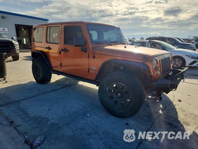 Czwarte zdjęcie samochodu z boku: 2011 JEEP WRANGLER UNLIMITED SAHARA VIN:1J4BA5H13BL604184 - miniatura