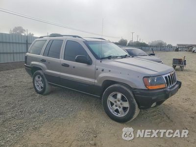 Czwarte zdjęcie samochodu z boku: 2002 JEEP GRAND CHEROKEE SPORT VIN:1J4GW38SX2C182175 - miniatura