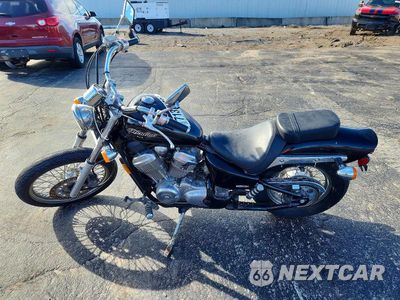 Trzecie zdjęcie samochodu z tyłu: 2006 HONDA VT600 C VIN:JH2PC21046M700158 - miniatura