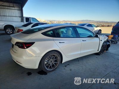 Trzecie zdjęcie samochodu z tyłu: 2022 TESLA MODEL 3 VIN:5YJ3E1EB0NF153646 - miniatura