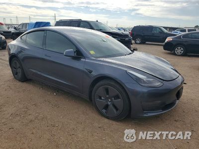 Czwarte zdjęcie samochodu z boku: 2023 TESLA MODEL 3 VIN:5YJ3E1EAXPF657972 - miniatura