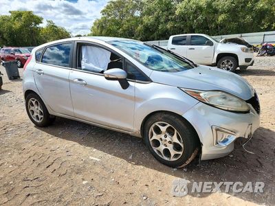 Czwarte zdjęcie samochodu z boku: 2011 FORD FIESTA SES VIN:3FADP4FJ2BM210058 - miniatura