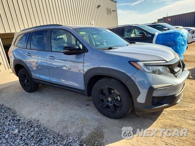 Czwarte zdjęcie samochodu z boku: 2022 HONDA PILOT TRAILSPORT VIN:5FNYF6H83NB048633 - miniatura
