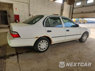 Trzecie zdjęcie samochodu z tyłu: 1997 TOYOTA COROLLA BASE VIN:1NXBA02E1VZ598691 - miniatura
