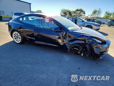 Czwarte zdjęcie samochodu z boku: 2022 TESLA MODEL 3 VIN:5YJ3E1EA2NF287839 - miniatura