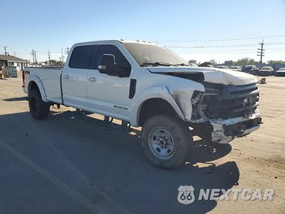 Czwarte zdjęcie samochodu z boku: 2022 FORD F350 SUPER DUTY VIN:1FT8W3BT3NEF50913 - miniatura