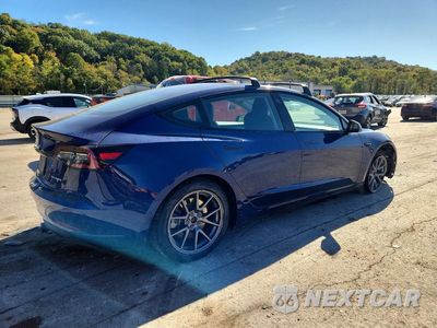 Trzecie zdjęcie samochodu z tyłu: 2021 TESLA MODEL 3 VIN:5YJ3E1EB7MF988187 - miniatura