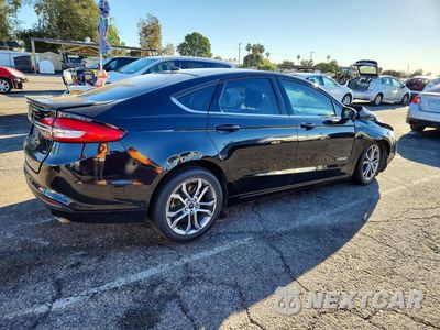 Trzecie zdjęcie samochodu z tyłu: 2017 FORD FUSION SE HYBRID VIN:3FA6P0LU8HR299971 - miniatura