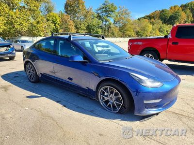 Czwarte zdjęcie samochodu z boku: 2021 TESLA MODEL 3 VIN:5YJ3E1EB7MF988187 - miniatura