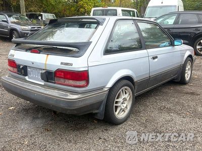 Trzecie zdjęcie samochodu z tyłu: 1988 MAZDA 323 GTX AWD VIN:JM1BF2346J0144896 - miniatura