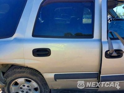 Zdjęcie 11 z 13 samochodu: 2004 CHEVROLET TAHOE C1500 VIN:1GNEC13Z34R140517 - miniatura