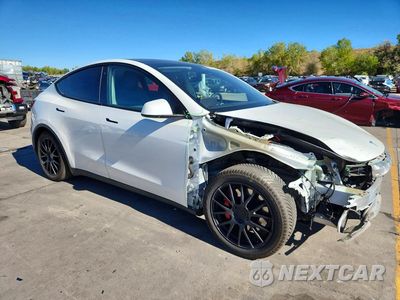 Czwarte zdjęcie samochodu z boku: 2020 TESLA MODEL Y VIN:5YJYGDEF0LF009919 - miniatura