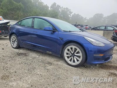 Czwarte zdjęcie samochodu z boku: 2022 TESLA MODEL 3 VIN:5YJ3E1EA0NF371934 - miniatura