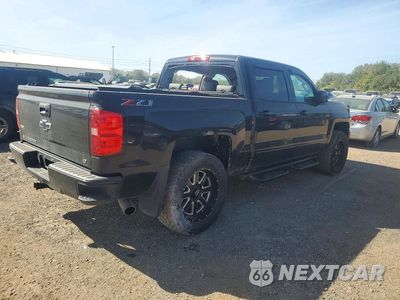 Trzecie zdjęcie samochodu z tyłu: 2018 CHEVROLET SILVERADO K1500 LT VIN:3GCUKRECXJG521520 - miniatura