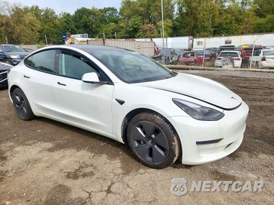 Czwarte zdjęcie samochodu z boku: 2021 TESLA MODEL 3 VIN:5YJ3E1EA2MF047057 - miniatura