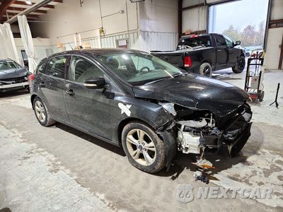 Czwarte zdjęcie samochodu z boku: 2014 FORD FOCUS SE VIN:1FADP3K25EL307494 - miniatura