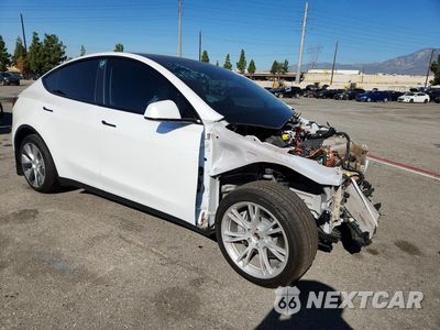 Czwarte zdjęcie samochodu z boku: 2022 TESLA MODEL Y VIN:7SAYGDEE8NF403262 - miniatura