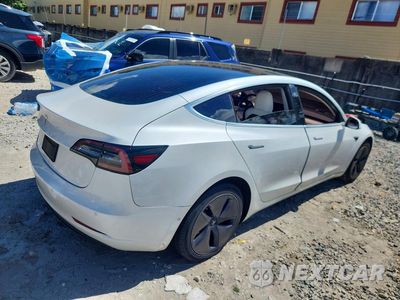 Trzecie zdjęcie samochodu z tyłu: 2020 TESLA MODEL 3 VIN:5YJ3E1EAXLF741039 - miniatura