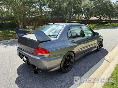 Czwarte zdjęcie samochodu z boku: 2006 MITSUBISHI LANCER EVOLUTION VIN:JA3AH86C46U061574 - miniatura