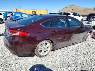 Trzecie zdjęcie samochodu z tyłu: 2018 FORD FUSION SE HYBRID VIN:3FA6P0LU2JR253106 - miniatura