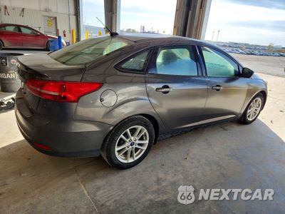 Trzecie zdjęcie samochodu z tyłu: 2018 FORD FOCUS SE VIN:1FADP3F27JL327881 - miniatura