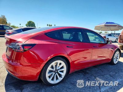 Trzecie zdjęcie samochodu z tyłu: 2022 TESLA MODEL 3 VIN:5YJ3E1EB4NF191672 - miniatura