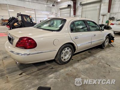 Trzecie zdjęcie samochodu z tyłu: 1999 LINCOLN CONTINENTAL VIN:1LNHM97V4XY718221 - miniatura