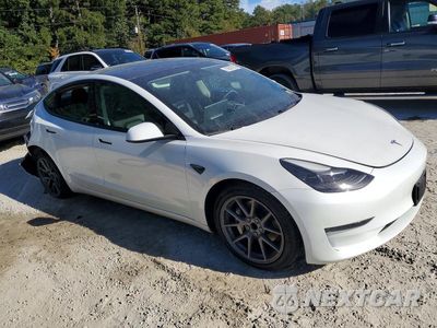 Czwarte zdjęcie samochodu z boku: 2023 TESLA MODEL 3 VIN:5YJ3E1EA4PF568446 - miniatura