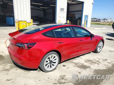 Trzecie zdjęcie samochodu z tyłu: 2022 TESLA MODEL 3 VIN:5YJ3E1EAXNF303978 - miniatura