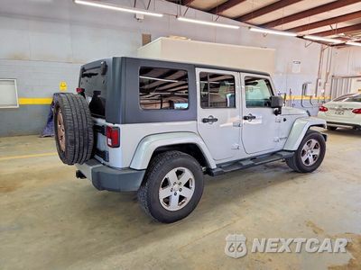 Trzecie zdjęcie samochodu z tyłu: 2010 JEEP WRANGLER UNLIMITED SAHARA VIN:1J4HA5H11AL221028 - miniatura