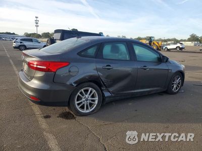 Trzecie zdjęcie samochodu z tyłu: 2017 FORD FOCUS SE VIN:1FADP3F24HL326567 - miniatura