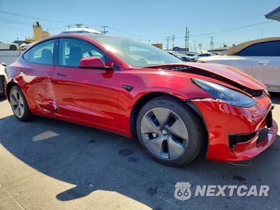 Czwarte zdjęcie samochodu z boku: 2022 TESLA MODEL 3 VIN:5YJ3E1EA9NF160991 - miniatura