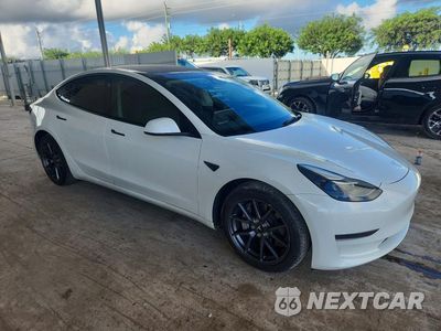 Czwarte zdjęcie samochodu z boku: 2023 TESLA MODEL 3 VIN:5YJ3E1EA8PF417481 - miniatura