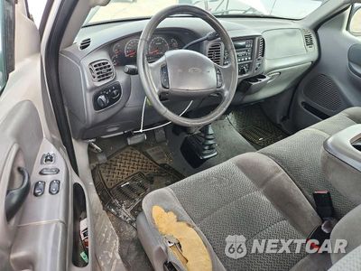 Zdjęcie 8 z 12 samochodu: 2001 FORD F150 VIN:1FTRX18W31NA50445 - miniatura