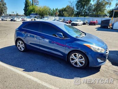 Czwarte zdjęcie samochodu z boku: 2014 HYUNDAI ELANTRA GT BASE VIN:KMHD35LH7EU195310 - miniatura