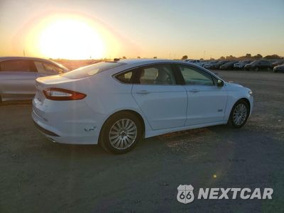Trzecie zdjęcie samochodu z tyłu: 2016 FORD FUSION SE PHEV VIN:3FA6P0PU5GR166495 - miniatura