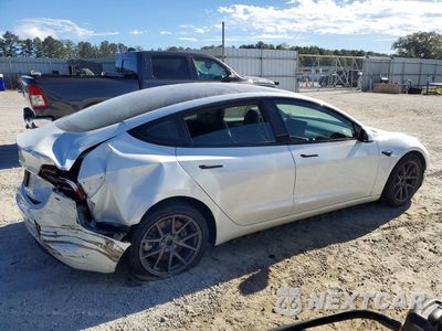 Trzecie zdjęcie samochodu z tyłu: 2023 TESLA MODEL 3 VIN:5YJ3E1EA4PF568446 - miniatura