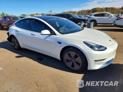 Czwarte zdjęcie samochodu z boku: 2022 TESLA MODEL 3 VIN:5YJ3E1EB0NF107489 - miniatura