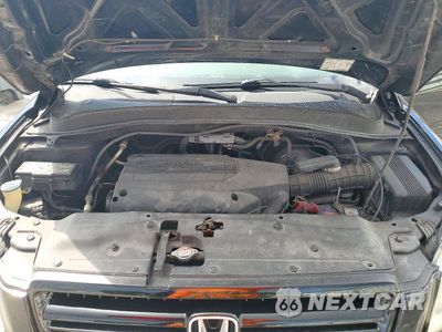 Zdjęcie 12 z 13 samochodu: 2004 HONDA PILOT EX VIN:5FNYF18424B002788 - miniatura