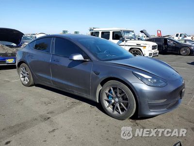 Czwarte zdjęcie samochodu z boku: 2021 TESLA MODEL 3 VIN:5YJ3E1EA1MF007259 - miniatura