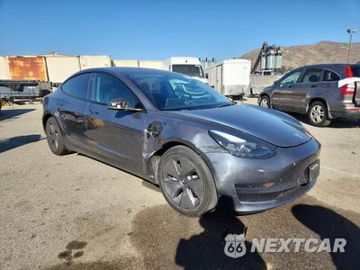 Czwarte zdjęcie samochodu z boku: 2023 TESLA MODEL 3 VIN:5YJ3E1EAXPF498967 - miniatura