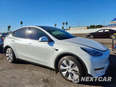 Czwarte zdjęcie samochodu z boku: 2023 TESLA MODEL Y VIN:7SAYGDEE0PA137770 - miniatura