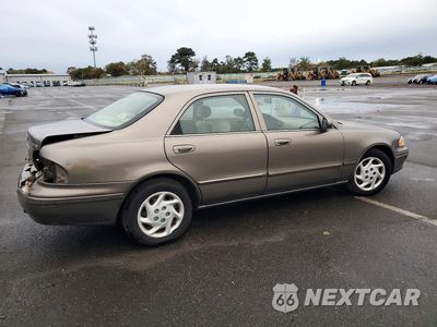 Trzecie zdjęcie samochodu z tyłu: 2002 MAZDA 626 LX VIN:1YVGF22C025298789 - miniatura