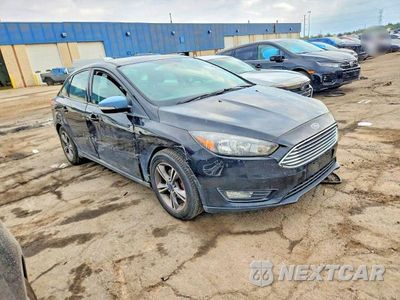 Czwarte zdjęcie samochodu z boku: 2018 FORD FOCUS SE VIN:1FADP3F21JL249128 - miniatura