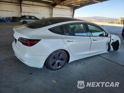 Trzecie zdjęcie samochodu z tyłu: 2021 TESLA MODEL 3 VIN:5YJ3E1EBXMF078582 - miniatura