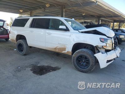 Czwarte zdjęcie samochodu z boku: 2016 CHEVROLET SUBURBAN K1500 LT VIN:1GNSKHKC0GR182143 - miniatura