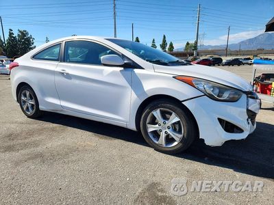 Czwarte zdjęcie samochodu z boku: 2013 HYUNDAI ELANTRA COUPE GS VIN:KMHDH6AE6DU016768 - miniatura